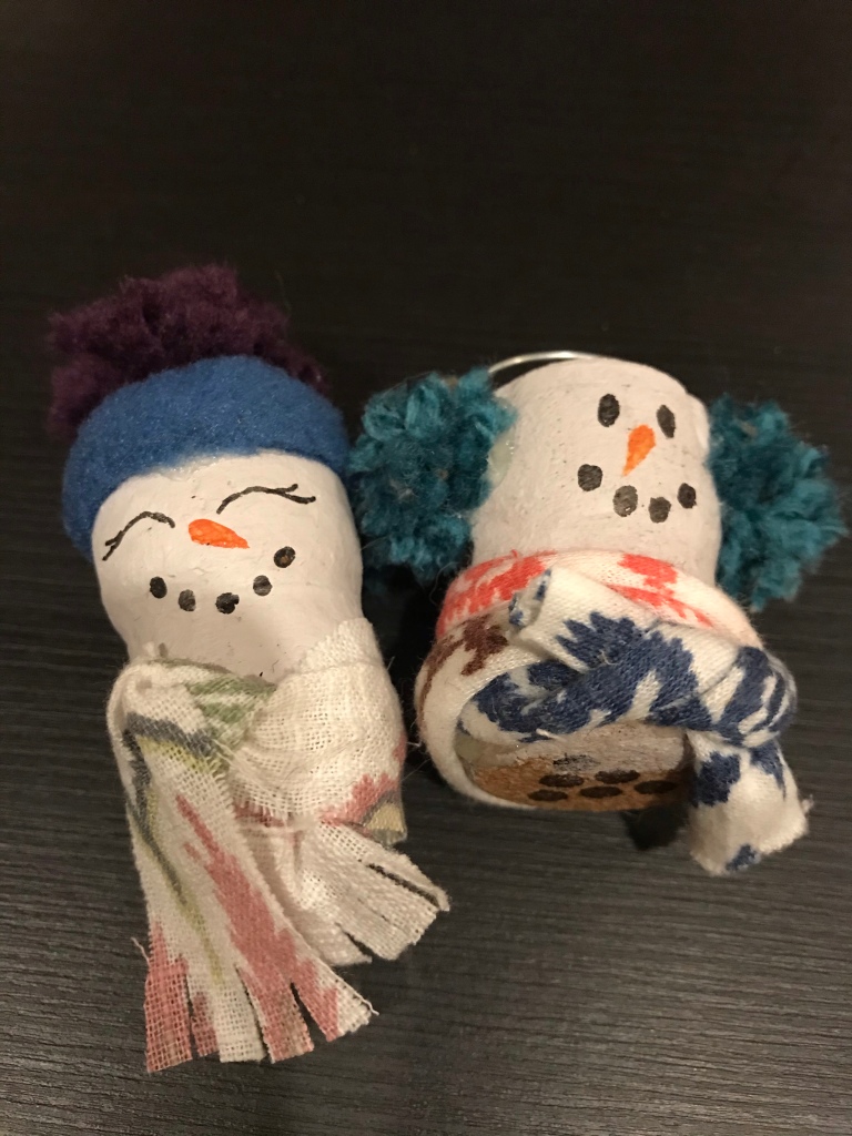 Two decorated cork snowmen